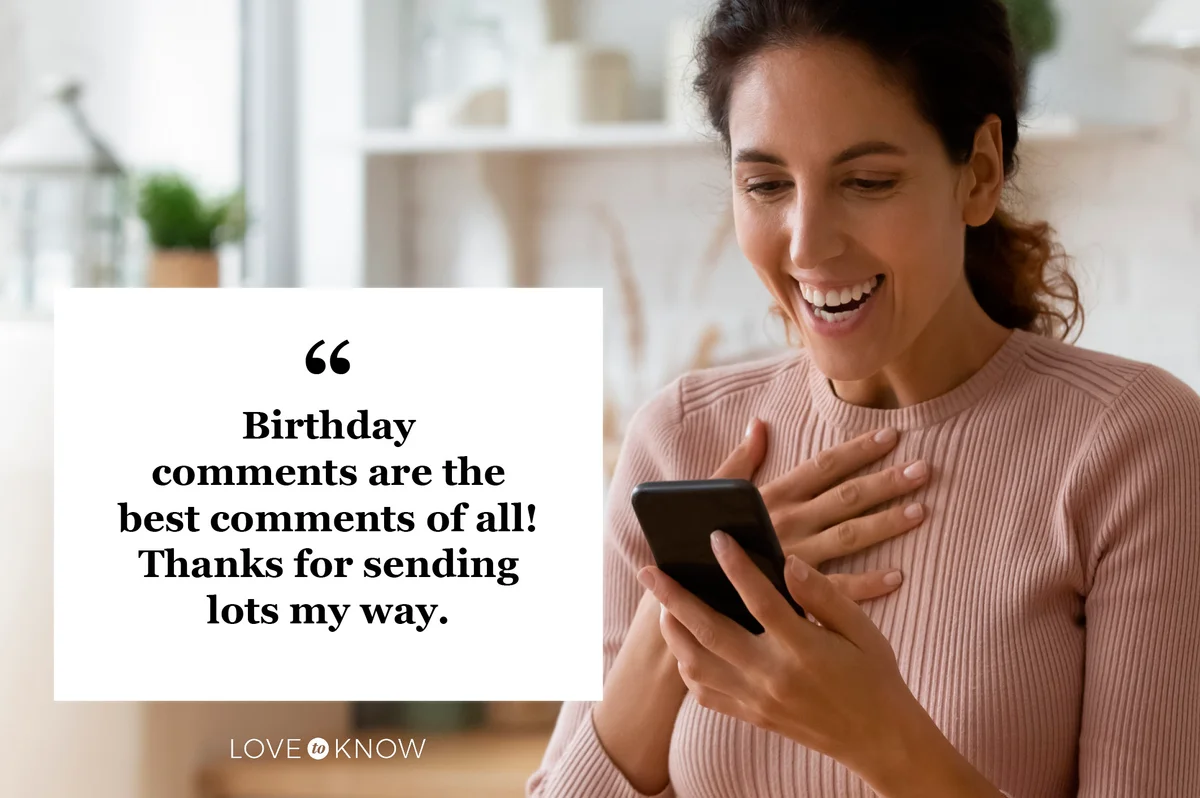 happy woman reading birthday comments on her phone from social media