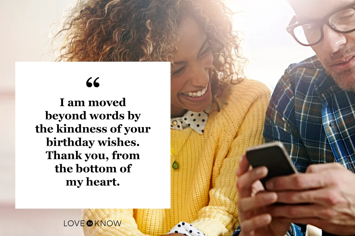 grateful couple reading birthday wishes from social media on phone