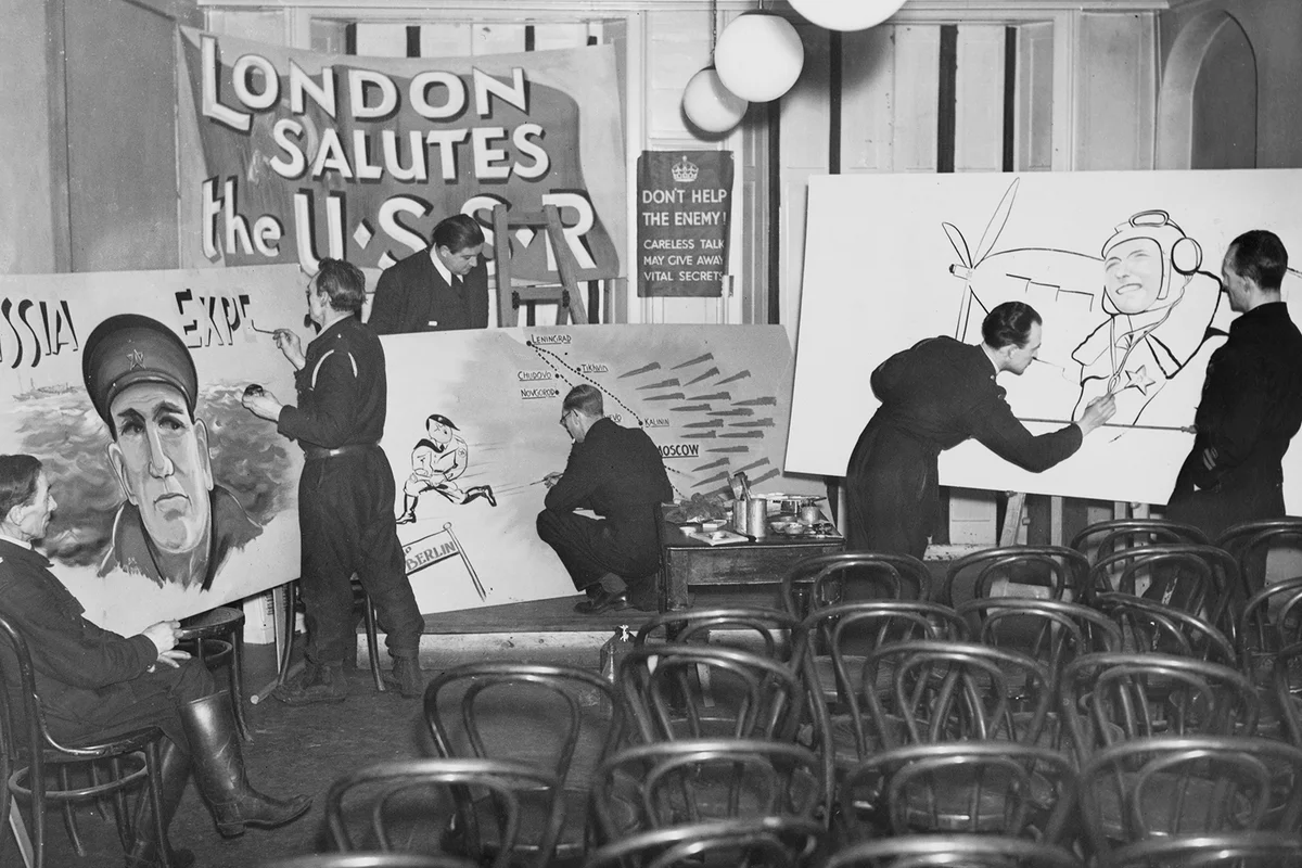 Air Raid Precaution (ARP) wardens from the London Borough of Islington and signwriters in their civilian life paint propaganda posters - Getty Editorial Use