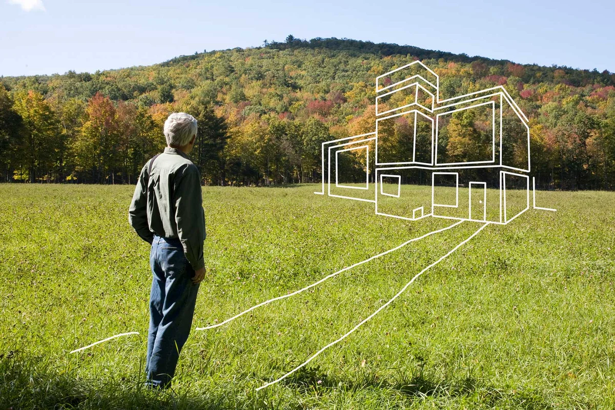man envisioning house plans