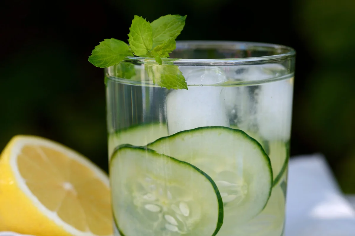 Cucumber water in glass and lemon