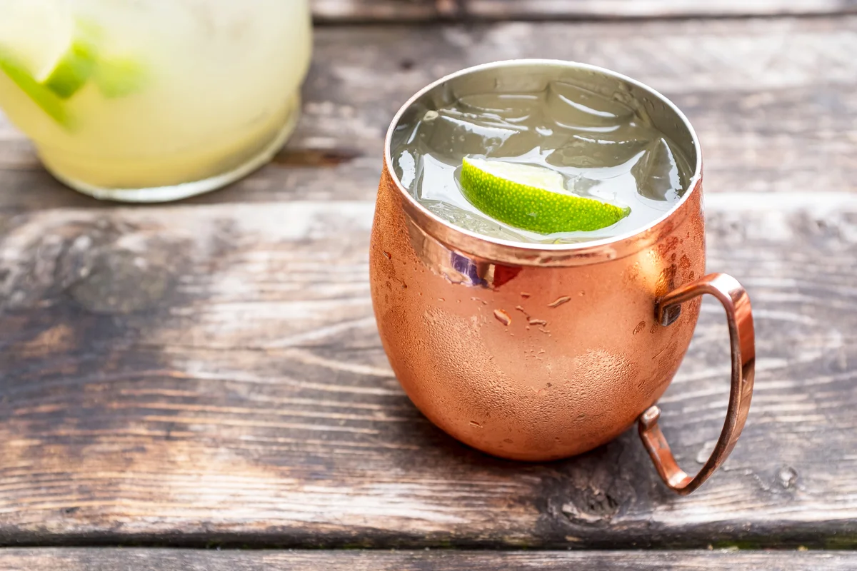 Kentucky Mule in a copper mug on an old wooden table