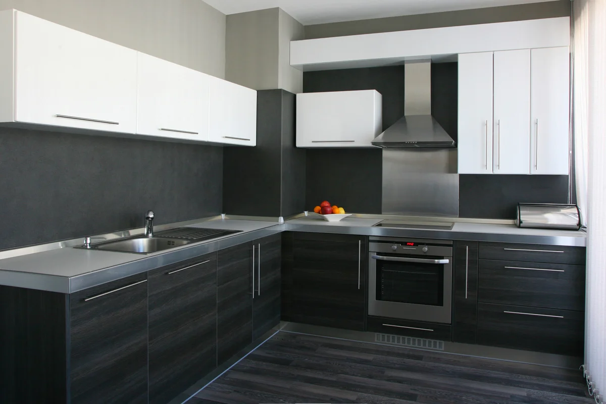 kitchen with black and white cabinets