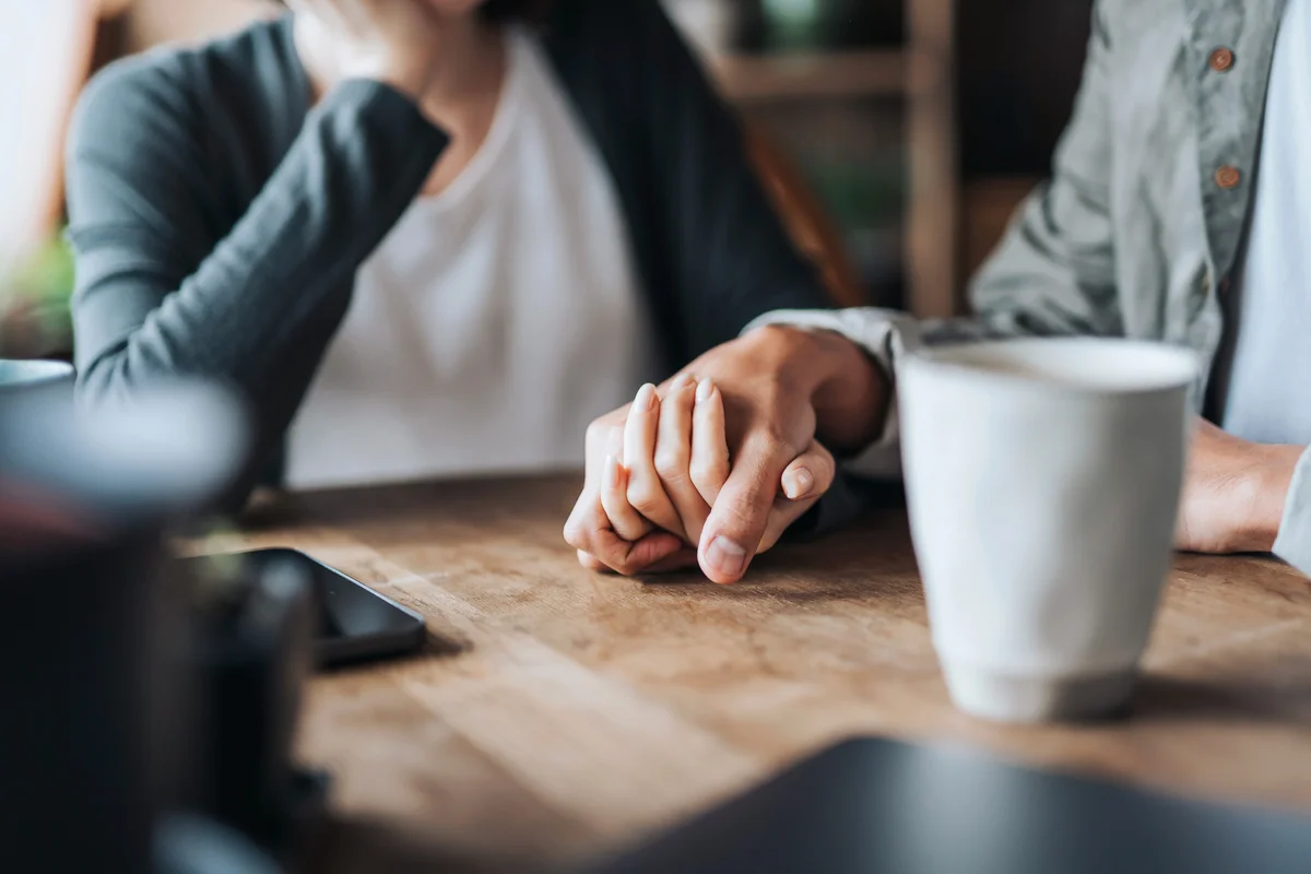Couple holding hands