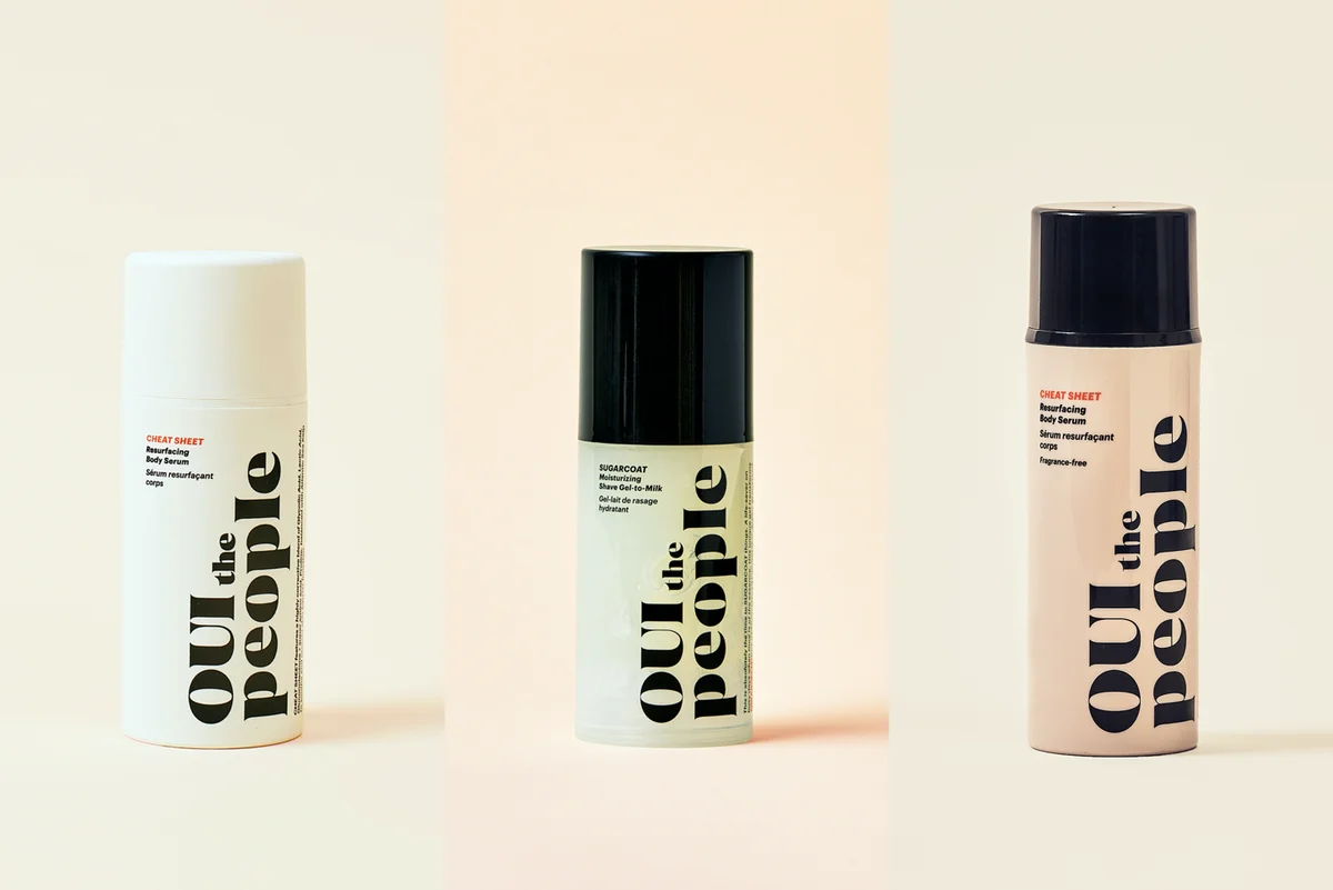 Photo of three products from OUI the People including two bottles of Cheat Sheet and bottle of Sugarcoat.