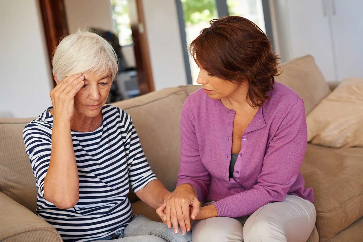 woman comforting mother after death of spouse