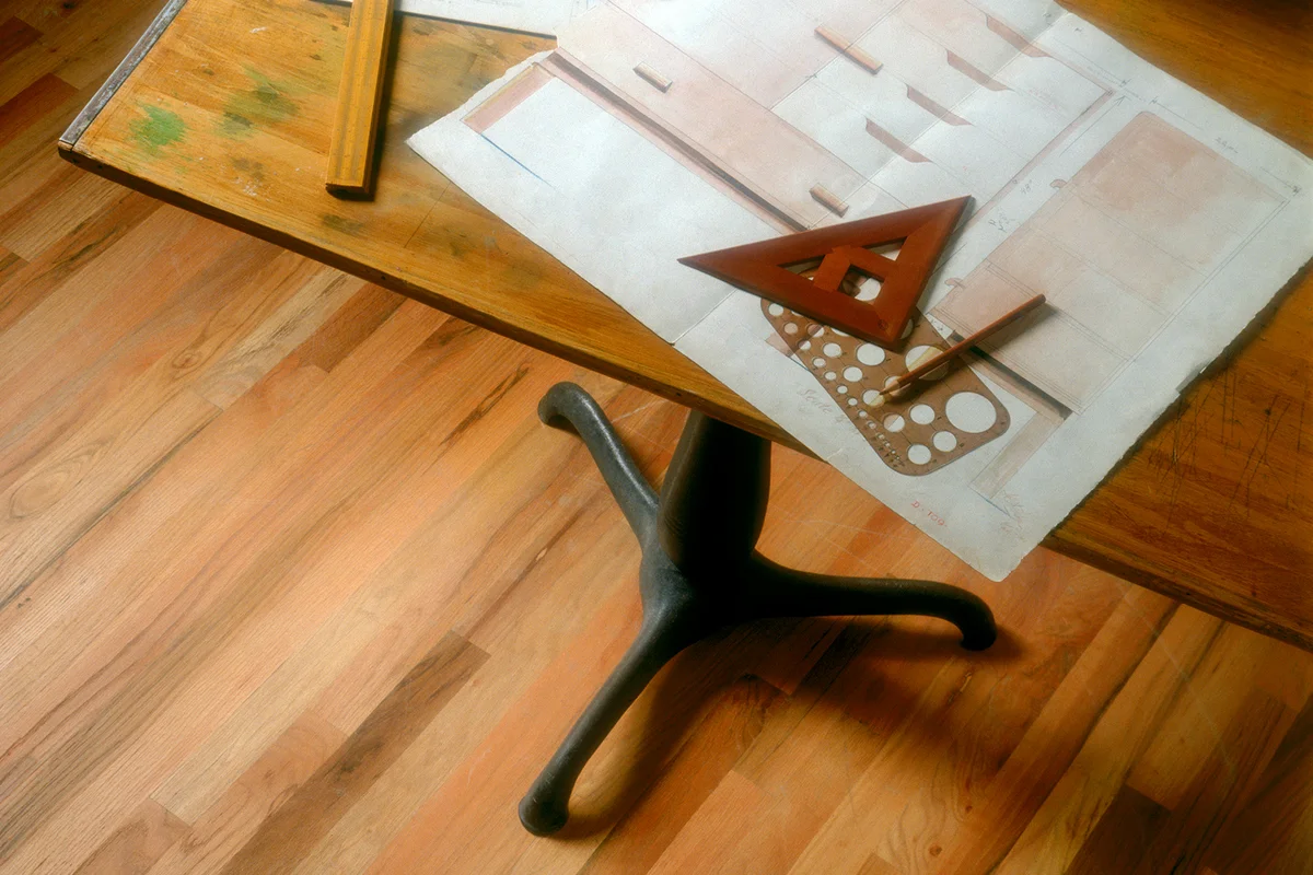 Old Drafting Table with Plans and Supplies