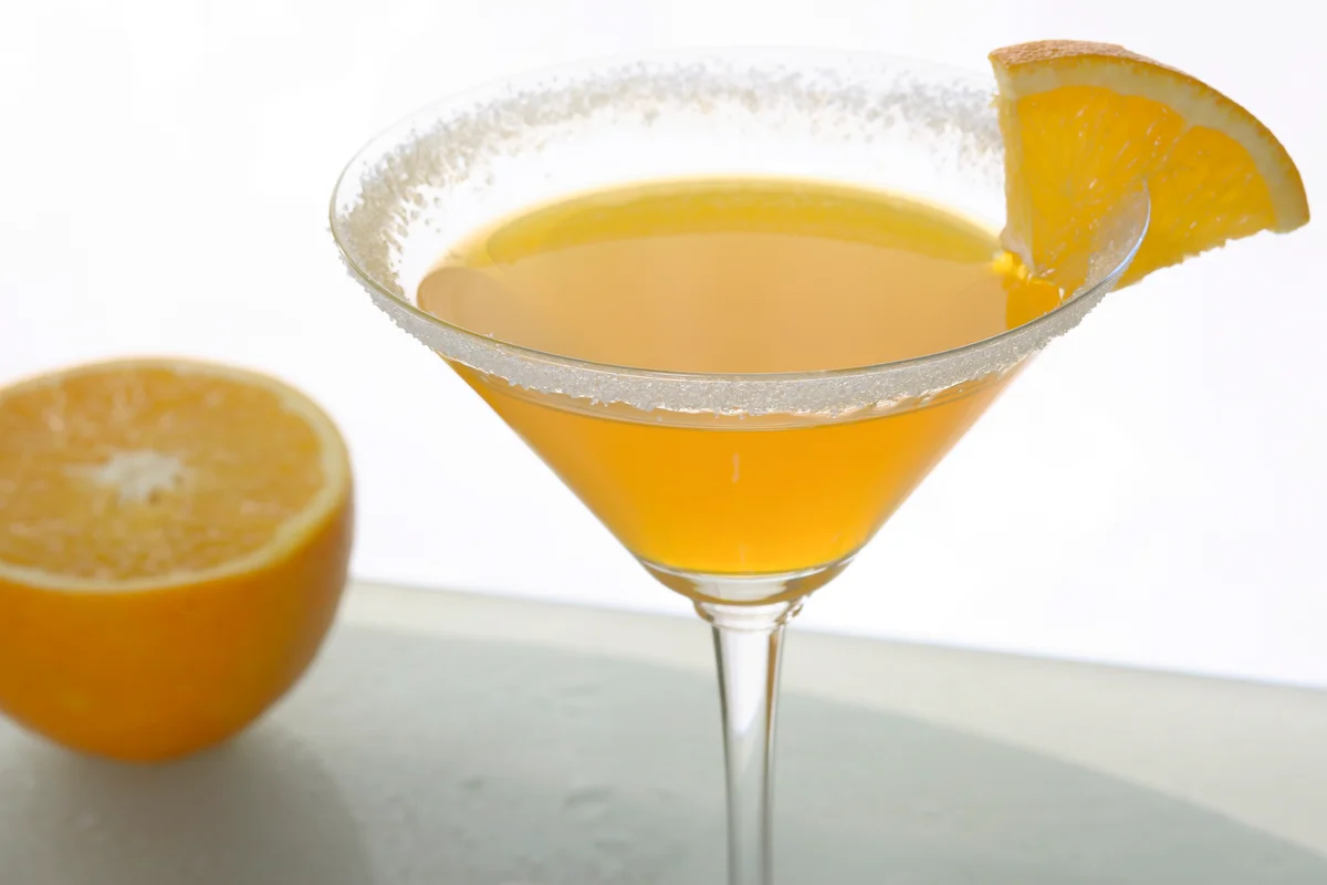 Martini glass with banana and orange cocktail