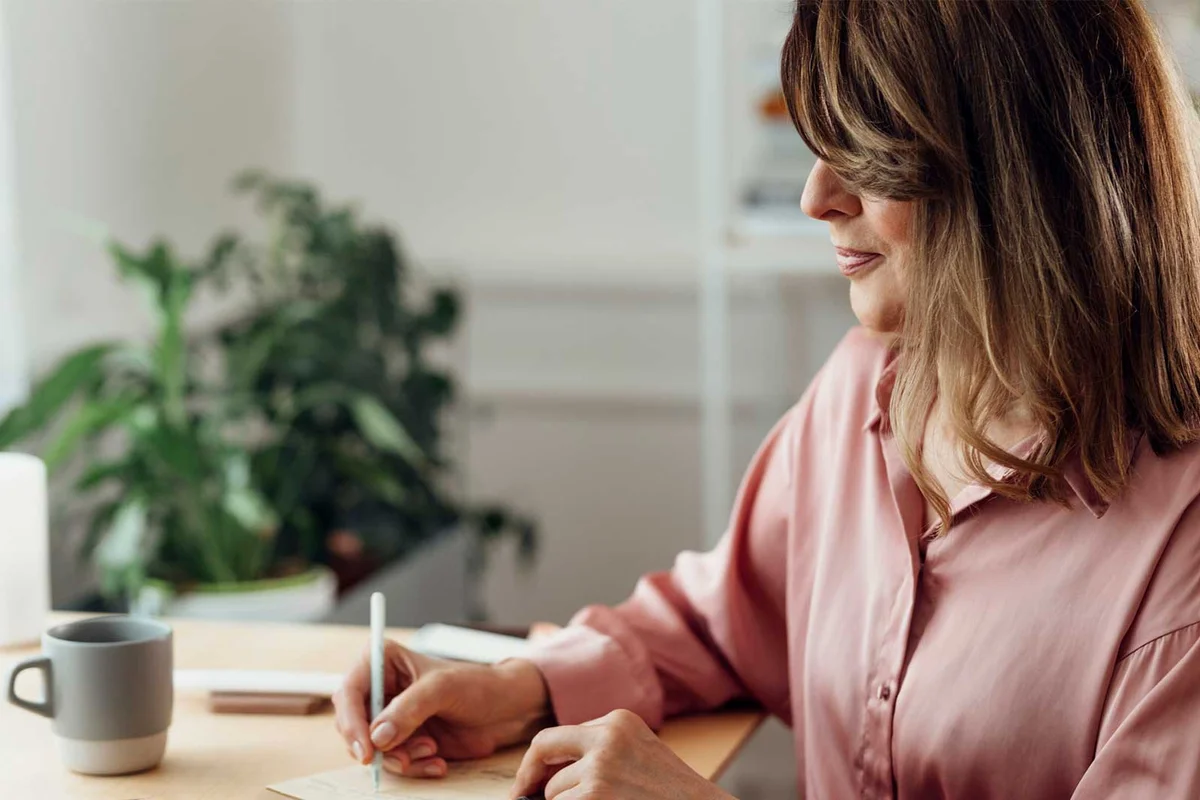 woman writing invitation