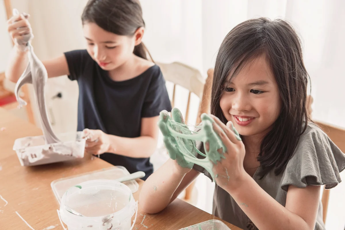 Friends making homemade slime toy