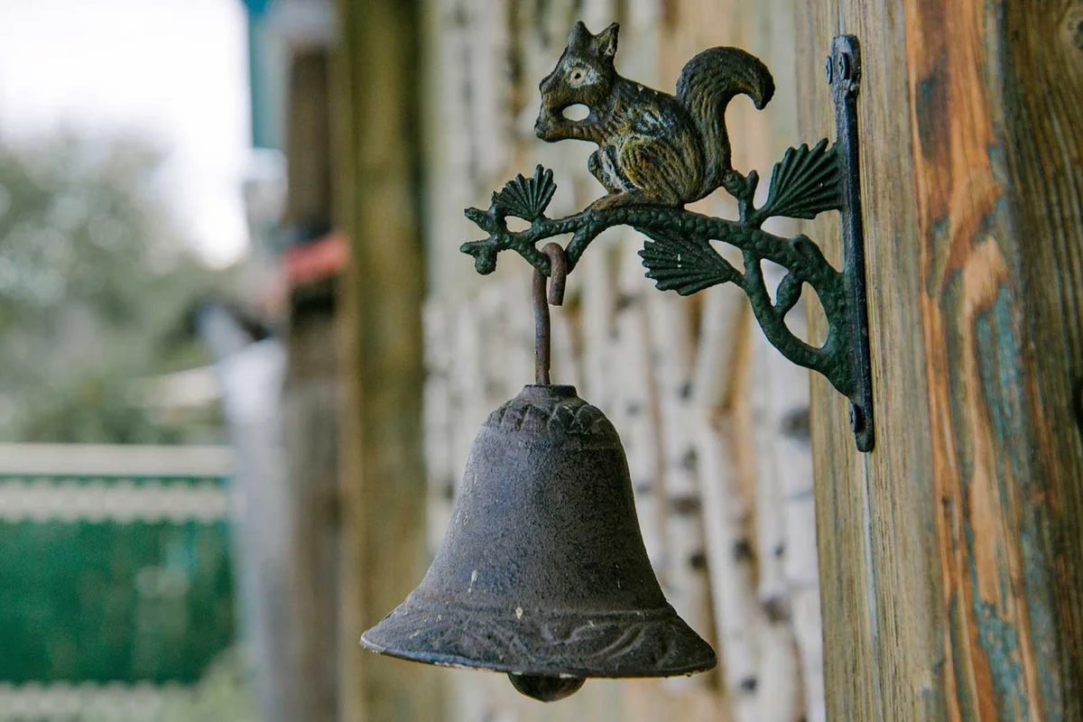 rustic dinner bell with squirrel decoration