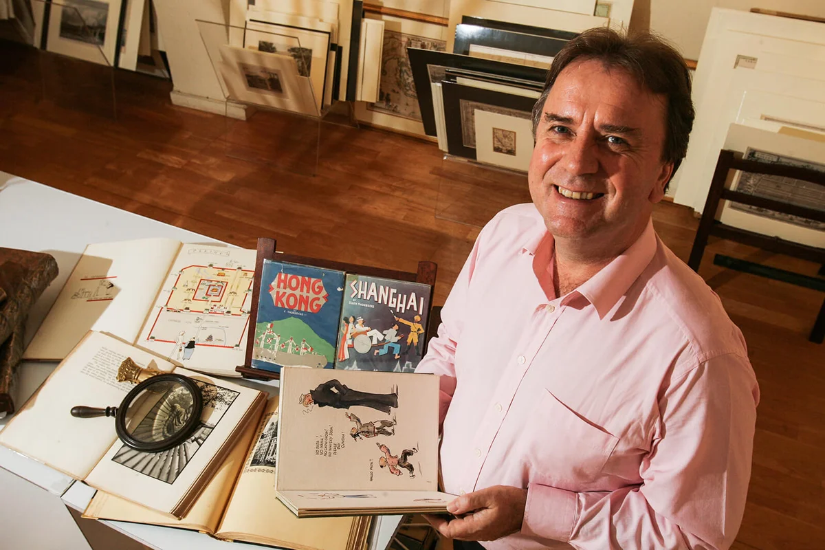 Rare book dealer Jonathan Wattis with some of the rare chinese books in his collection | Getty Editorial Use