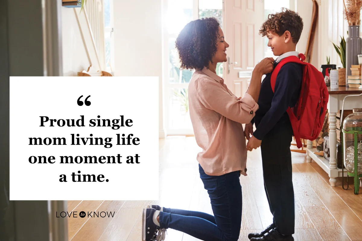 Single Mother At Home Getting Son Wearing Uniform Ready For First Day Of School