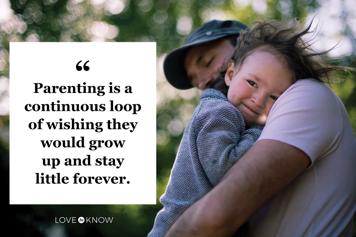 Two year old is being held by dad