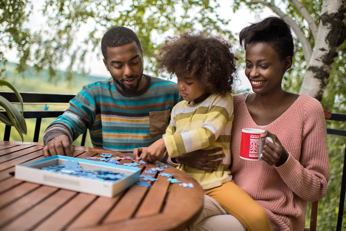 Couple enjoying with their daughter on terrace