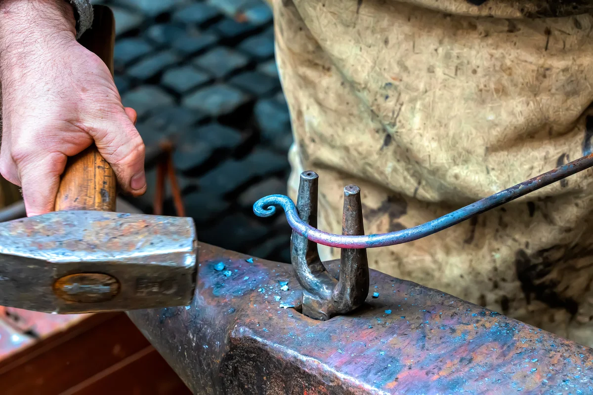 vintage blacksmith hammer bending metal