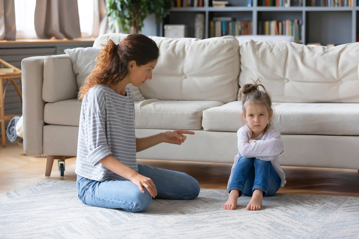 Strict mother scolding daughter