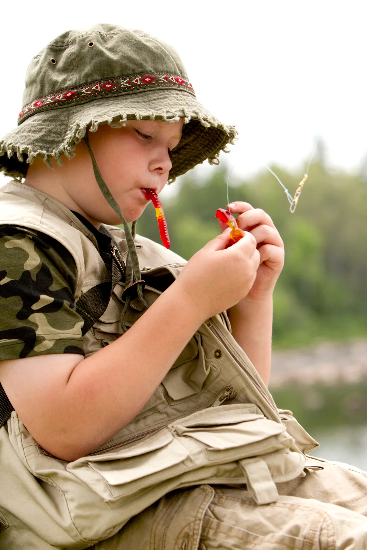 Boy fishing with candy worm