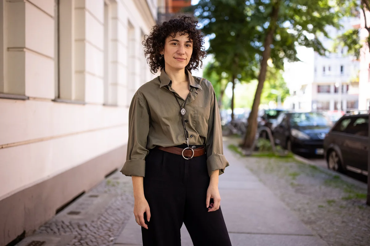 Portrait of a non binary person standing outside