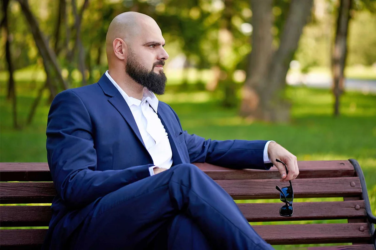 man in dark suit going to memorial service