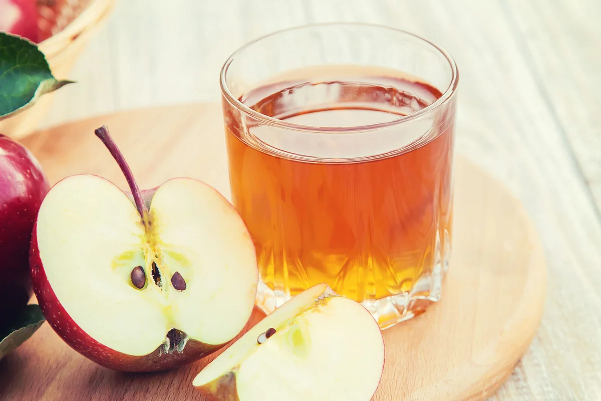 Apple juice in a glass Selective focus