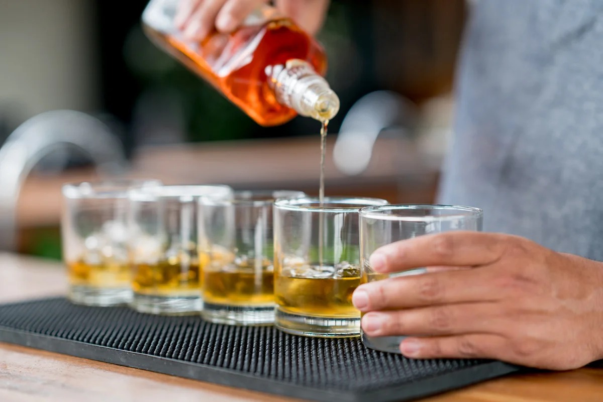 bartender pouring drinks