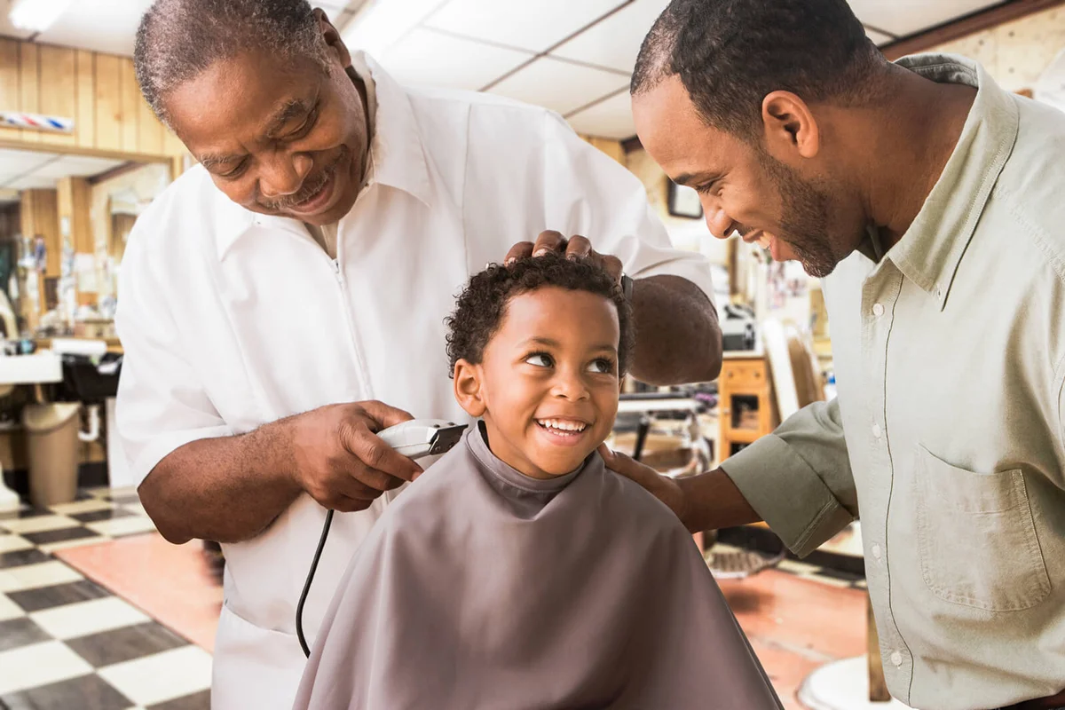 father and son at barbershop