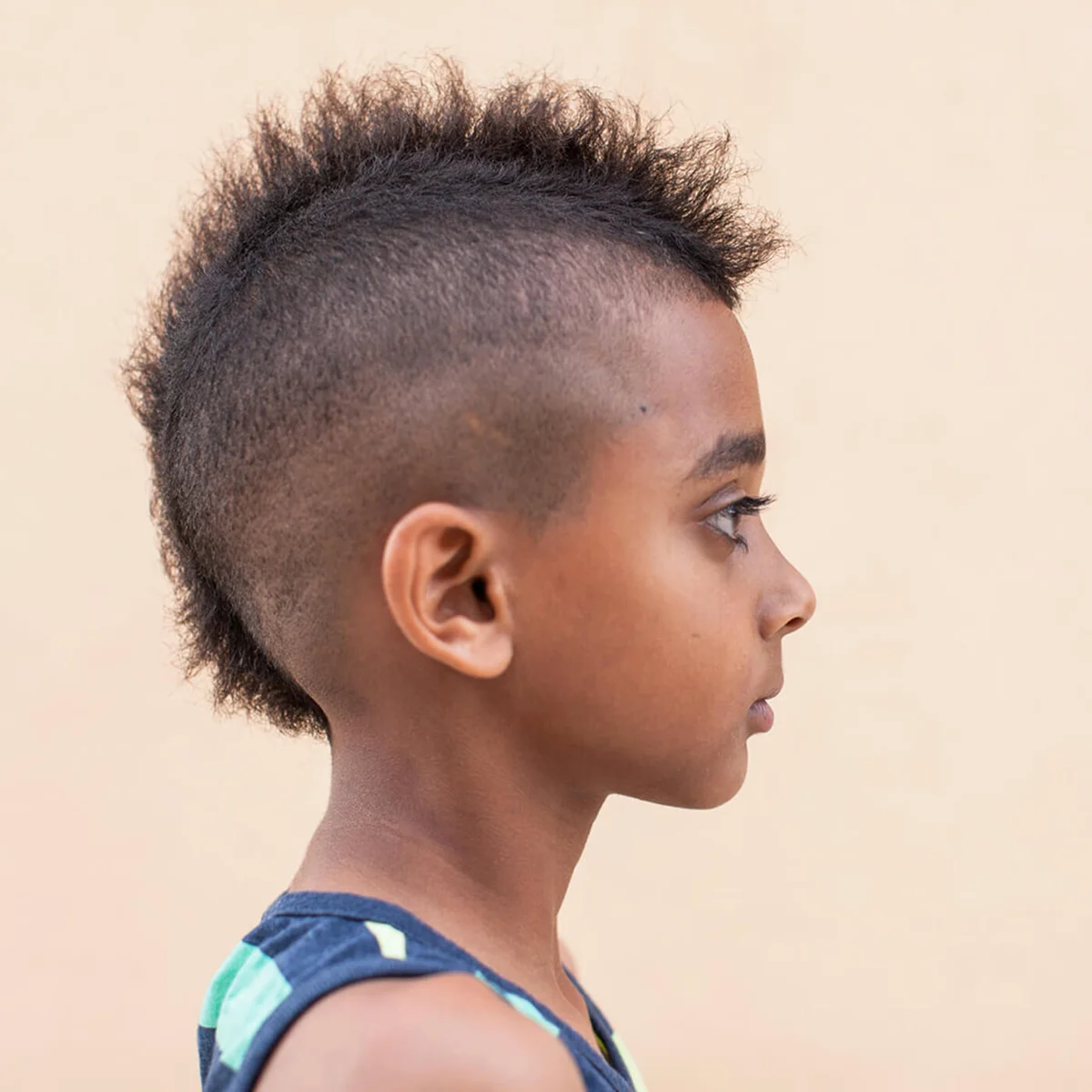 Portrait of boy with mohawk hairstyle