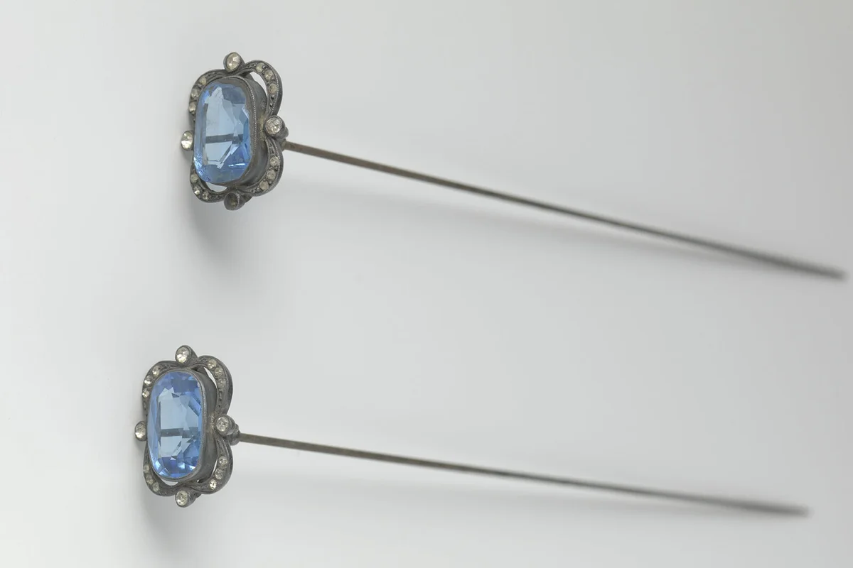 Hat pin made of steel with an elongated ornament of facet cut blue glass mounted in a steel rim with faceted cut bar | Getty Editorial Use