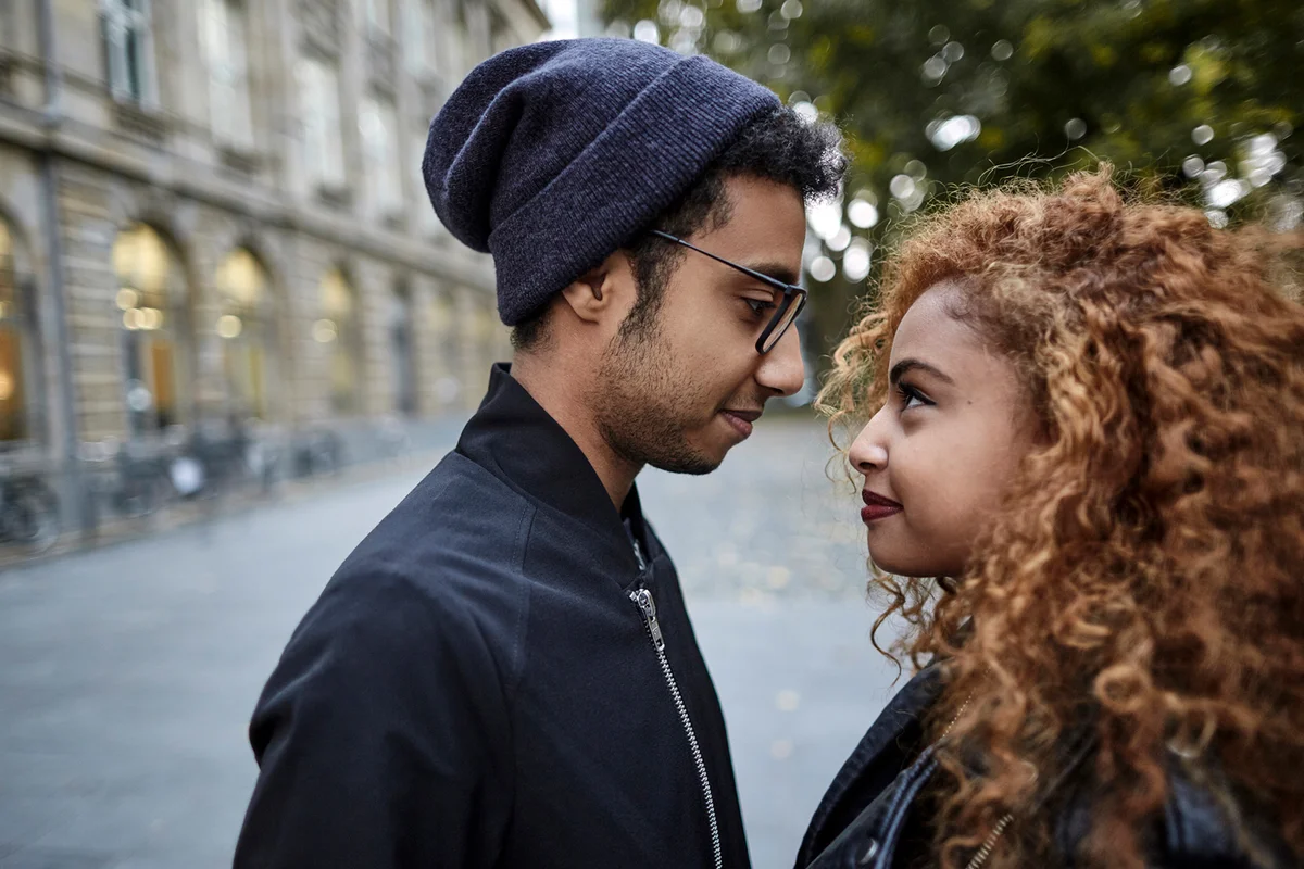 Young couple in the city looking at each other