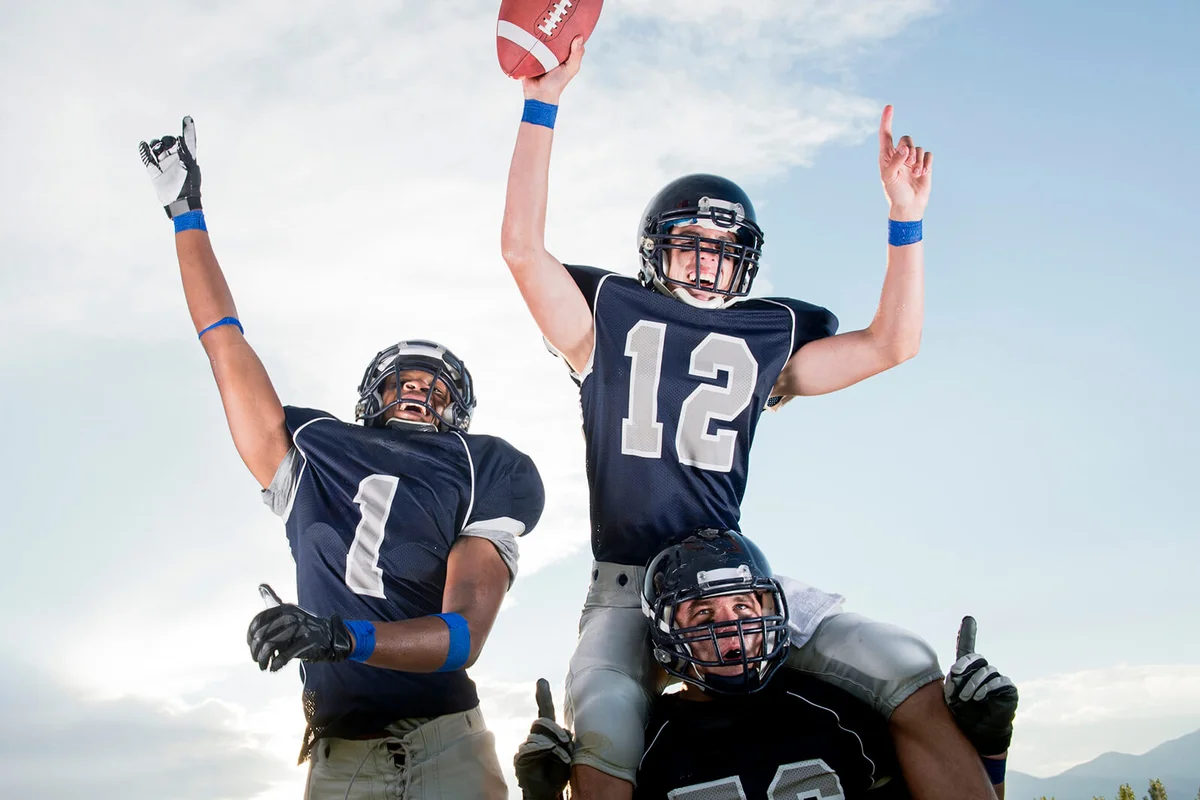 Football players cheering in game