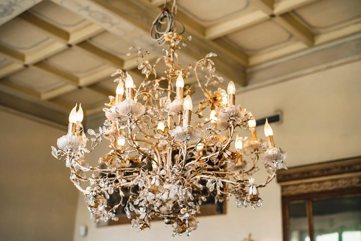 Illuminated Chandelier Hanging On Ceiling