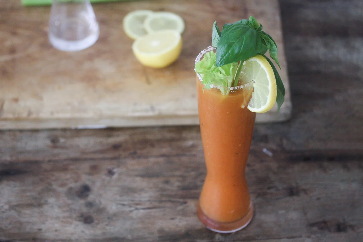 Bloody Mary Cocktail with lemon, celery, salt and basil