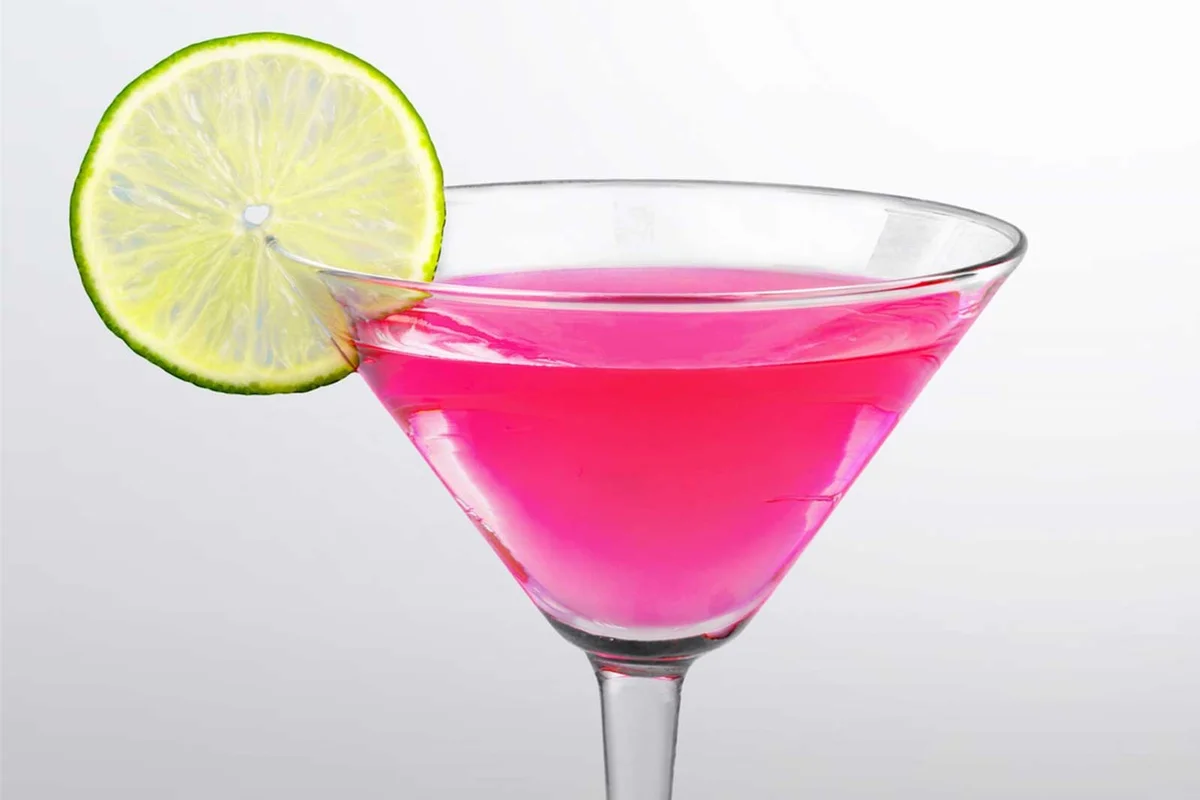 bubblegum martini with lime wheel garnish