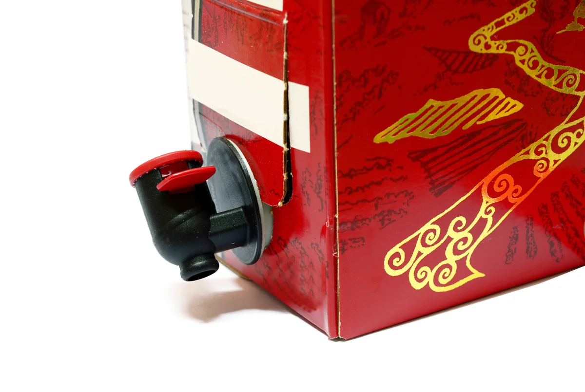 Paper box of red wine with black cock