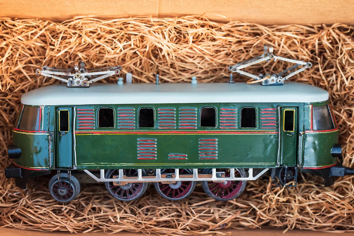 An antique toy Locomotive from early twentys in a padded box