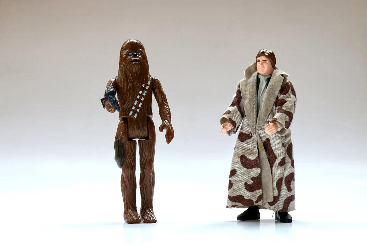 Vintage Star Wars Han Solo with Trench Coat and Chewbacca Action Figures from Kenner Toys on White | Photo 157210979 © Mrsorenschulz | Dreamstime.com