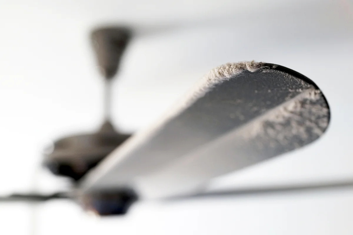 Dusty Ceiling Fan With Thick Dust Blocking The Air Flow
