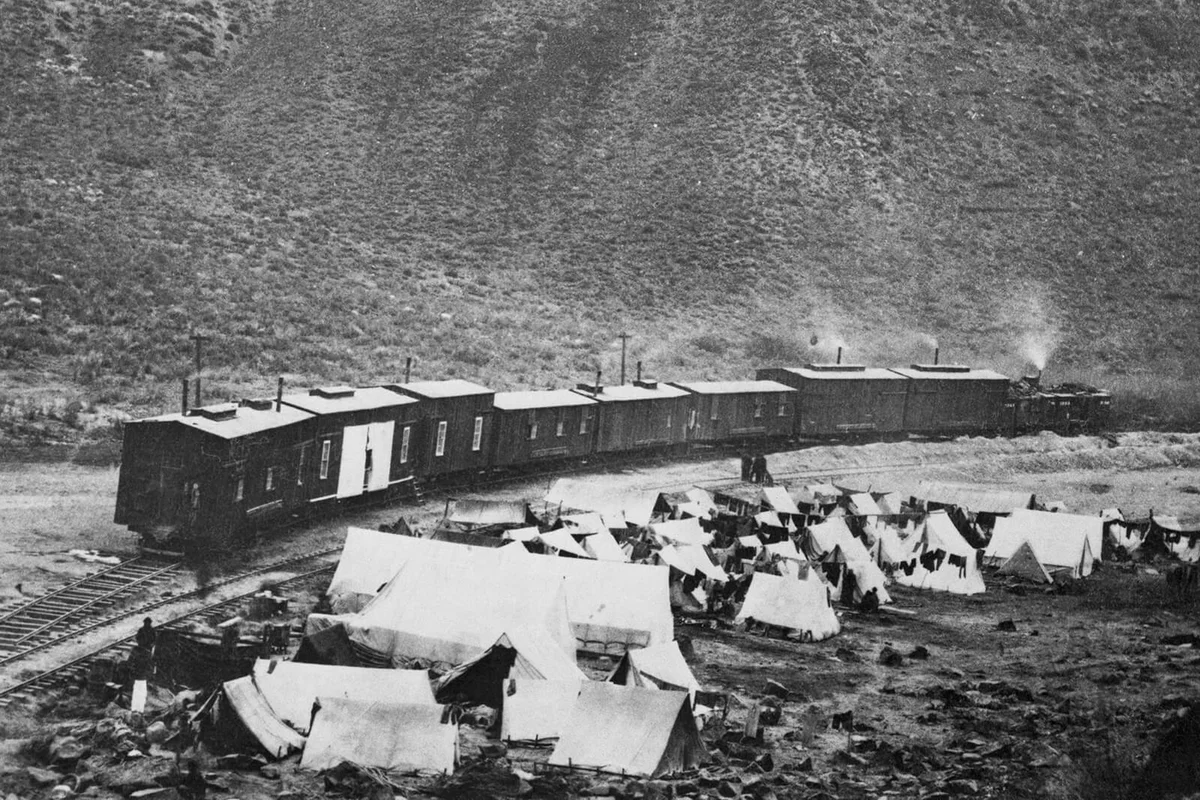 Chinese camp and construction train in Nevada when building of the first transcontinental railroad | Getty Editorial Use