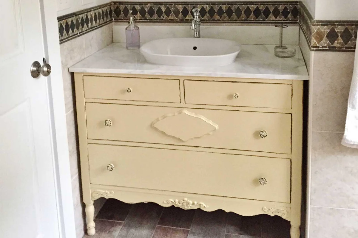 antique dresser turned into bathroom vanity
