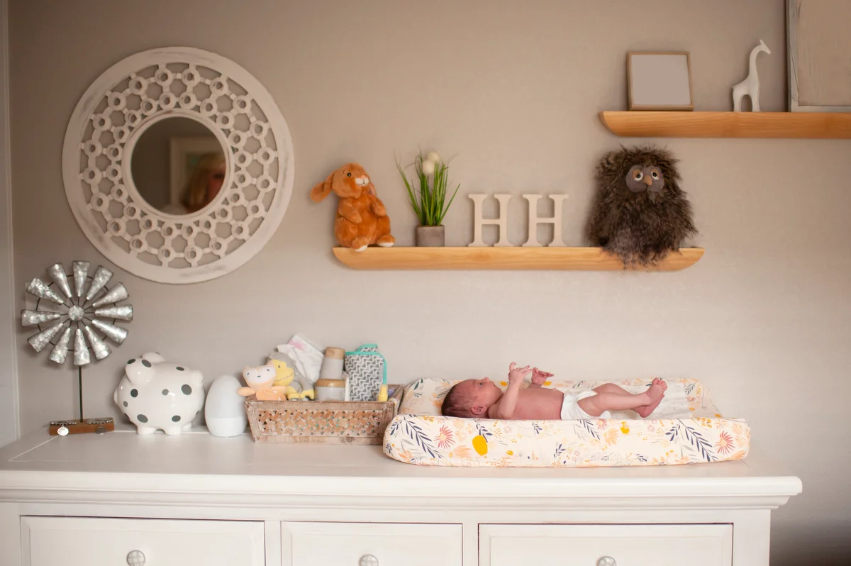 baby on changing table dresser