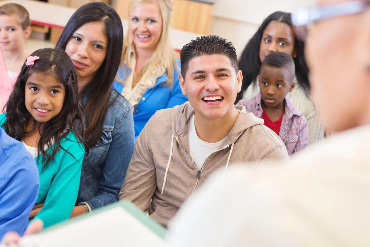 Parents and students attending school assembly or orientation