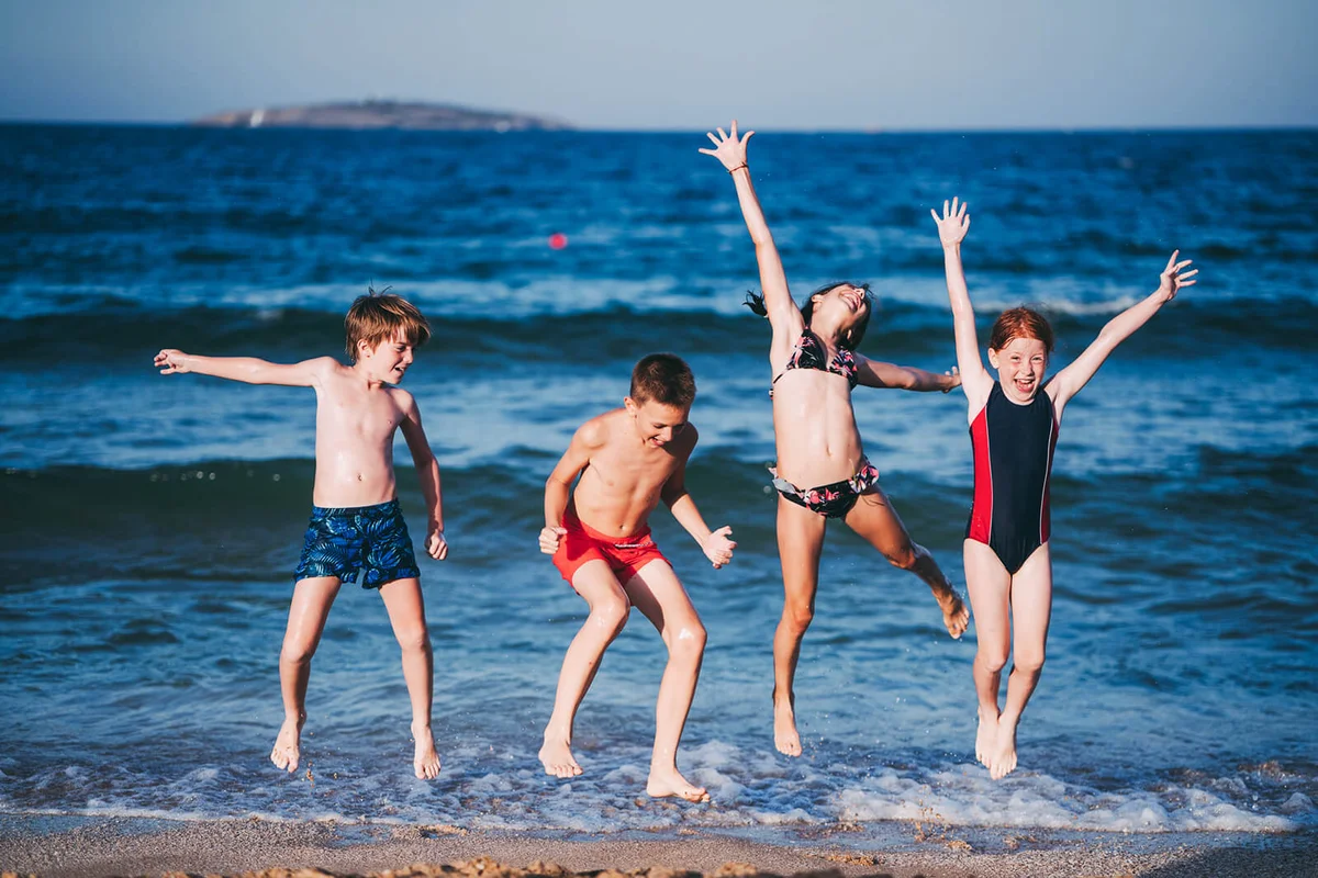 Group of kids playing at the beach