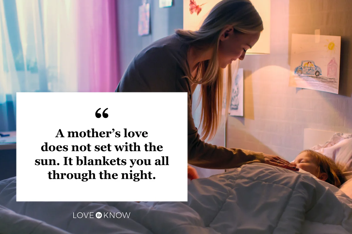 mother tucking daughter in to bed