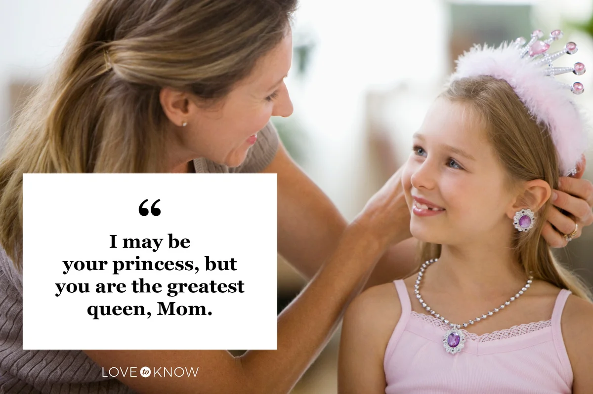 mother putting princess crown on daughter's head