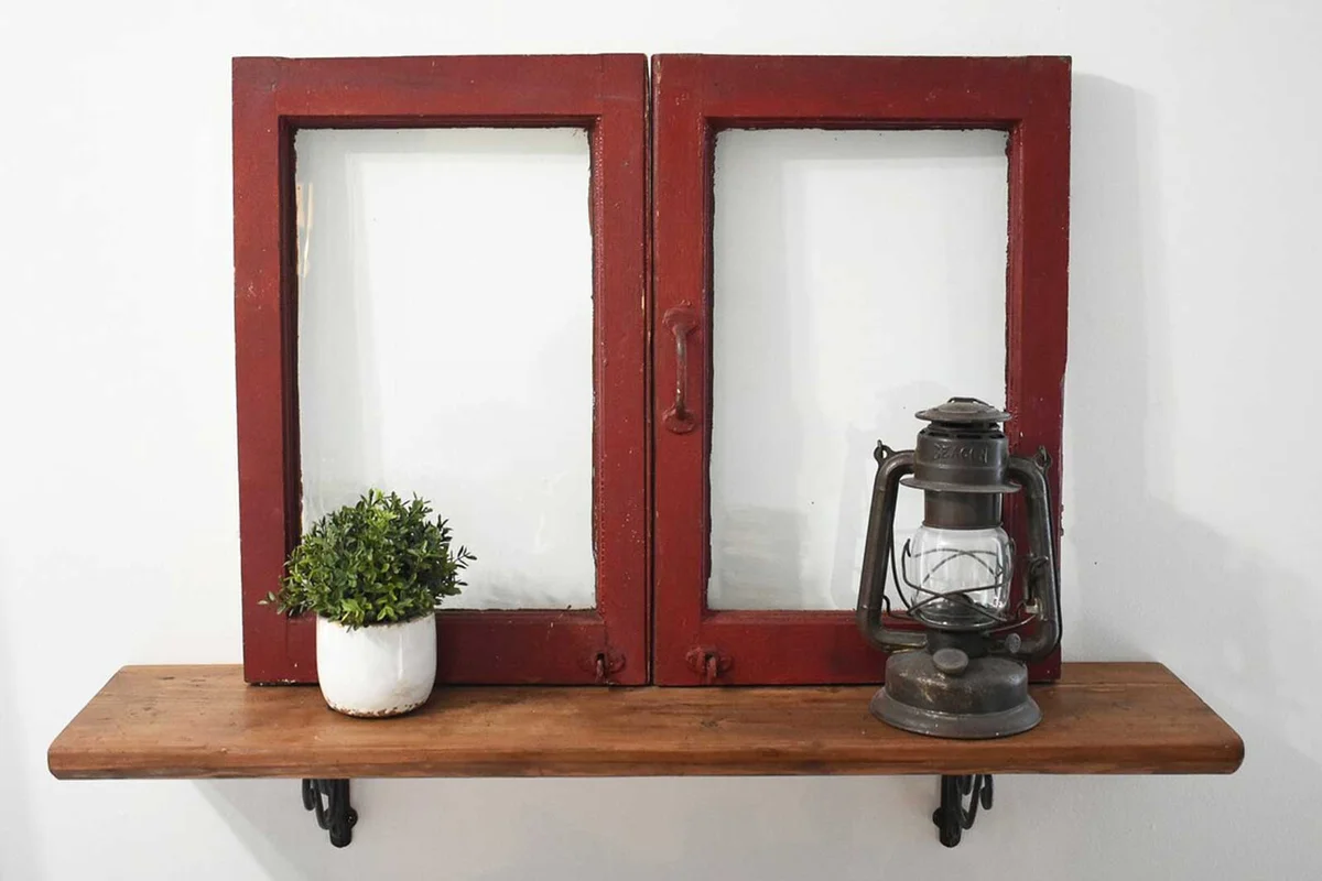 old window above shelf with decorative items