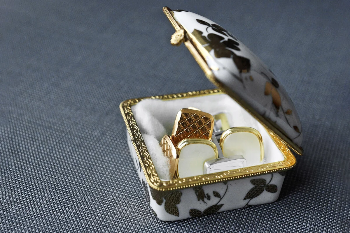 old treasure chest with a collection of cufflinks