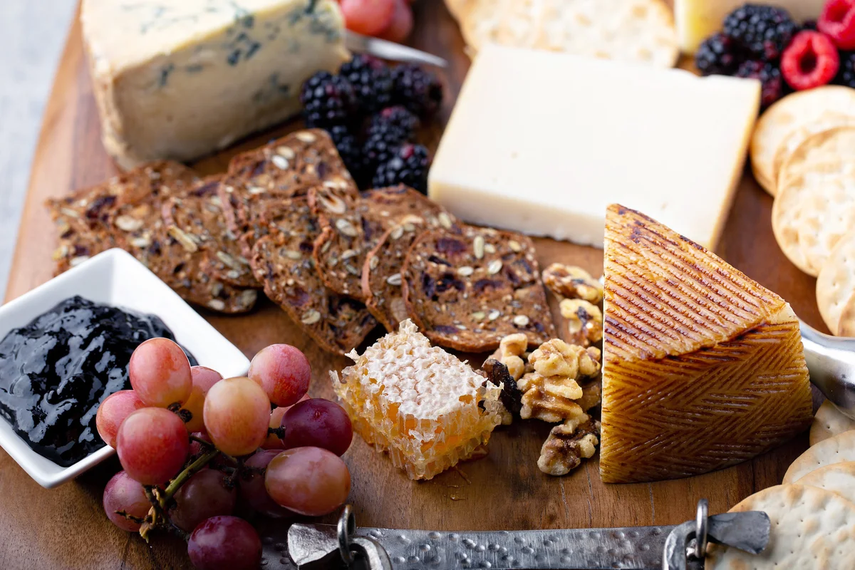Cheese board with honey and crackers