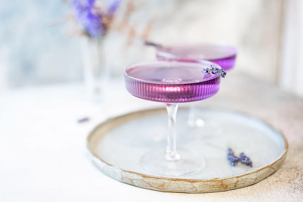 Purple cocktail drink in a glass