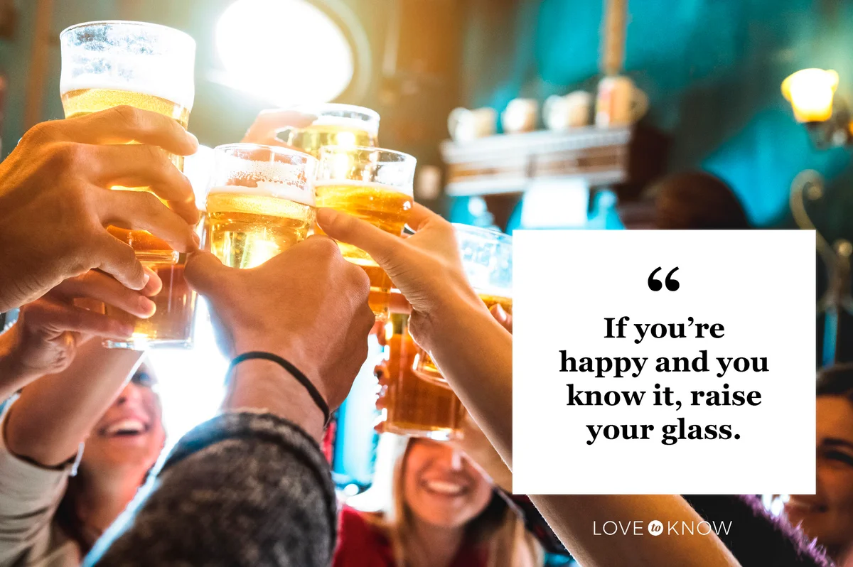 Drinking quote friends in bar raising glasses of beer to cheer